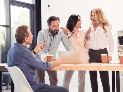 Group of Employees in Palm Bay, FL discussing a Group Health Insurance Policy