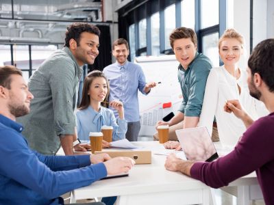 Group of Employees in Stuart, FL Discussing Insurance for Small Businesses