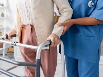 A nurse with liability insurance helping an elderly lady in Vero Beach, FL